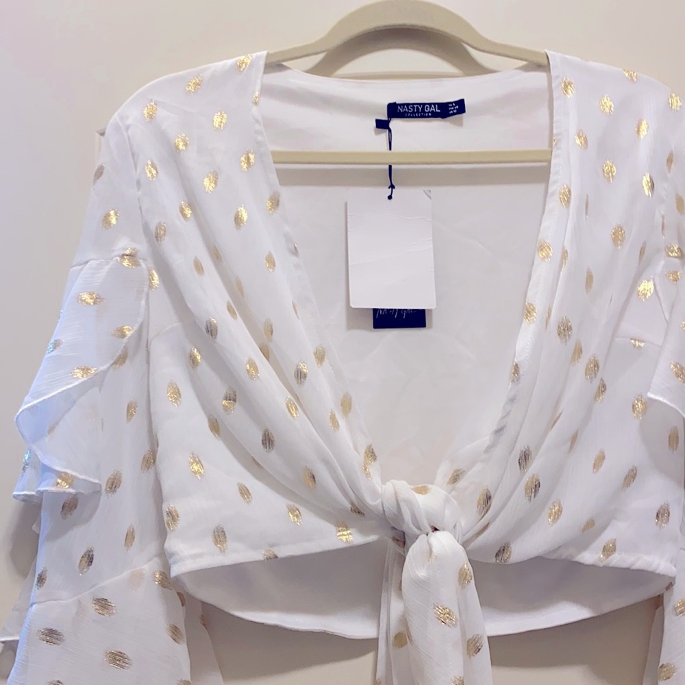 White and gold ruffle tie front top